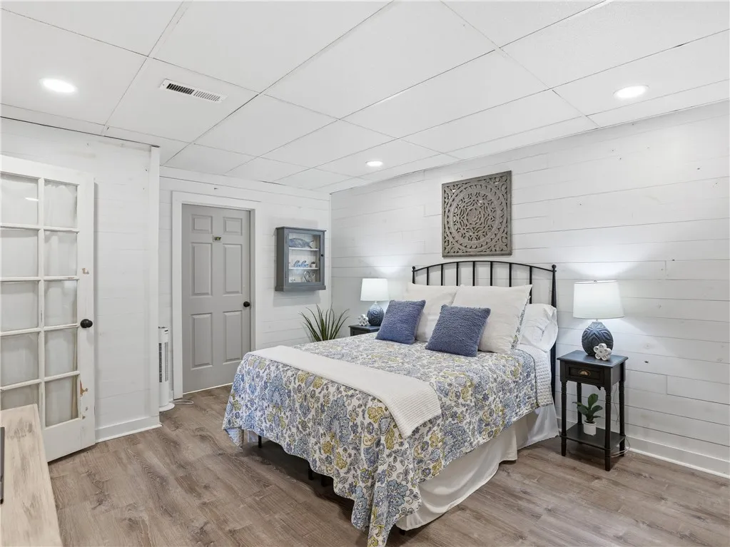 This cozy bedroom features durable flooring and ample natural light, perfect for restful nights.