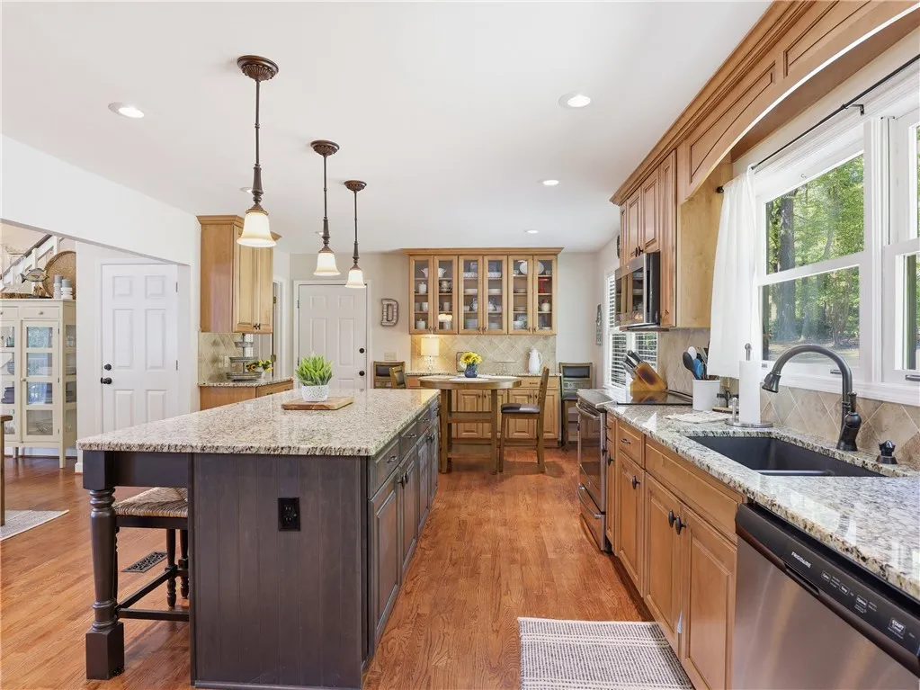 This spacious culinary haven features ample countertop space and abundant natural light.