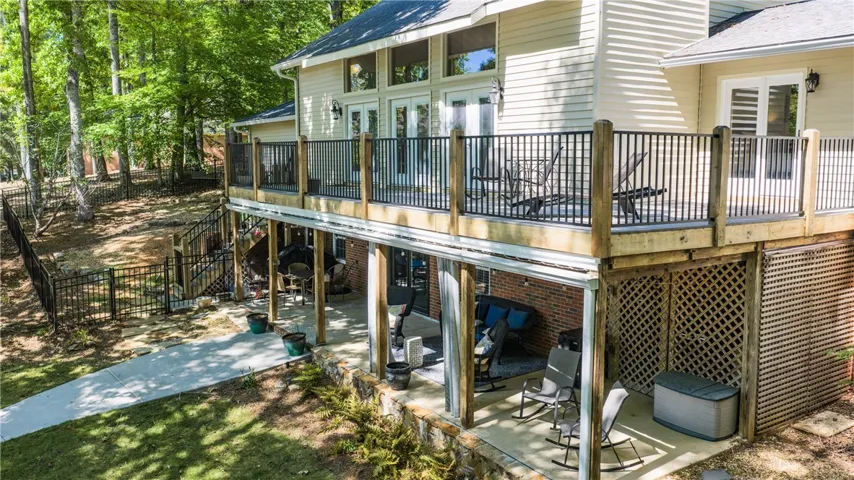 This home boasts a spacious patio and deck, perfect for outdoor living and entertaining.
