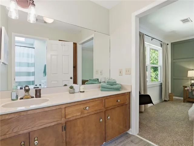 Bright vanity with ample counter space and a spacious mirror.