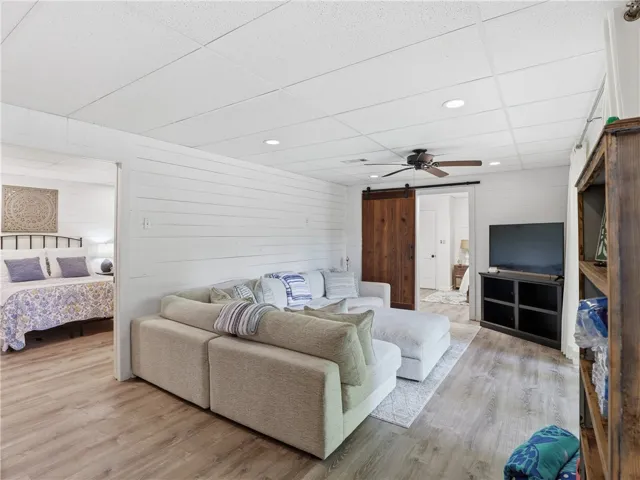 This versatile space features durable flooring, offering comfort and style for relaxation or entertainment.