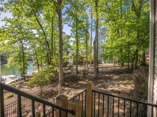 This tranquil outdoor space offers lush greenery and serene lake views.