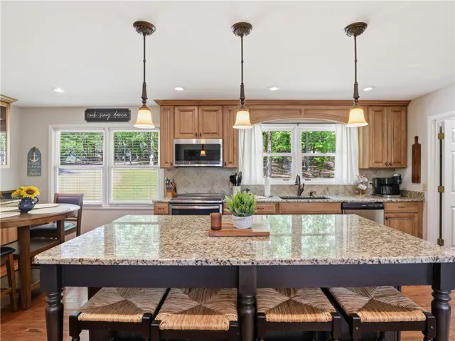 This kitchen showcases a central island, perfect for culinary endeavors and casual dining.