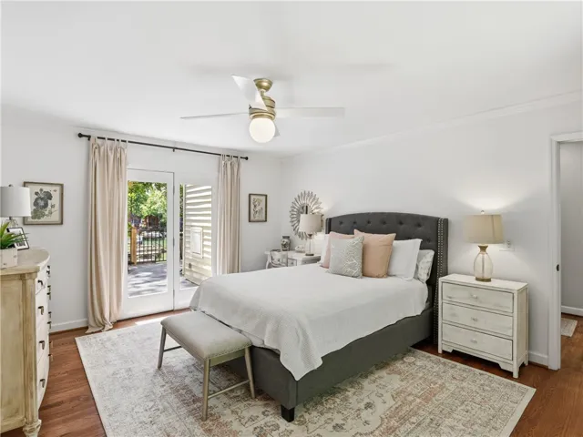 This airy bedroom offers a private retreat with direct access to outdoor living.