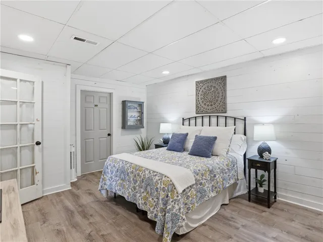 This cozy bedroom features durable flooring and ample natural light, perfect for restful nights.