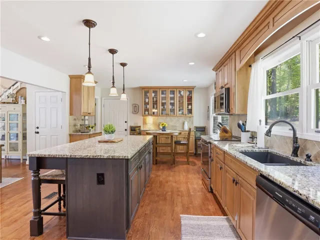 This spacious culinary haven features ample countertop space and abundant natural light.