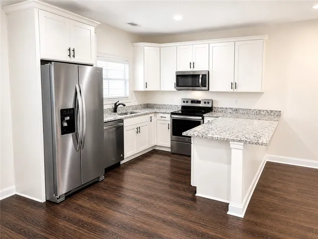 This modern kitchen features stainless steel appliances and abundant natural light.