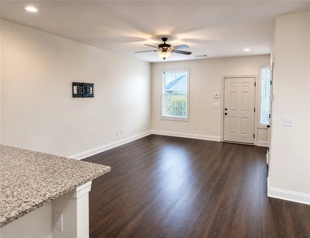 This living space features warm flooring, abundant light, and modern amenities.