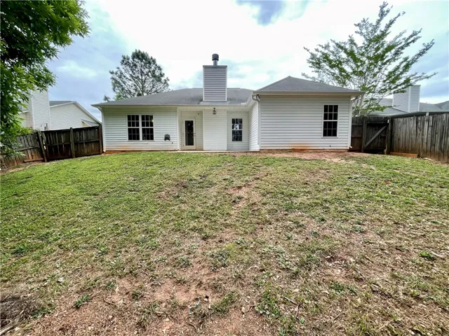 This private yard offers outdoor living with a fenced perimeter.
