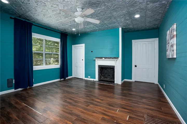 This vibrant room features a unique ceiling and warm flooring, perfect for a cozy living space.