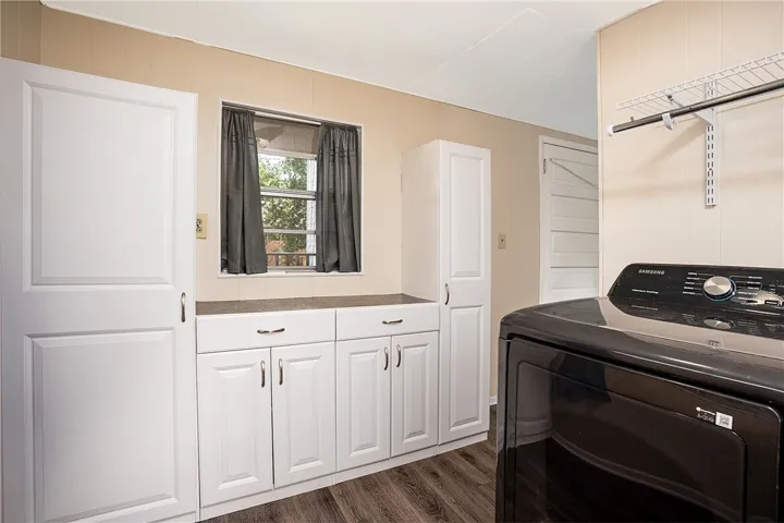This bright utility space features ample storage and modern conveniences for everyday living.