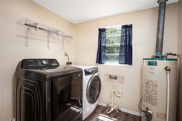 Functional laundry space with storage and essential appliances.