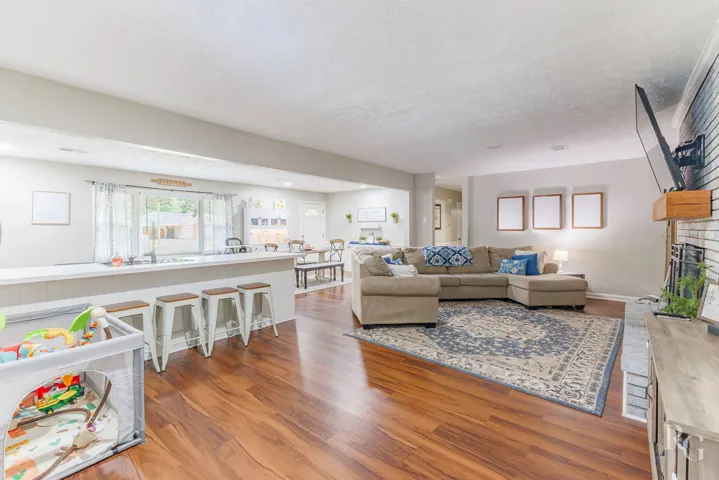This inviting space features an open floor plan connecting the living and dining areas, perfect for gatherings.