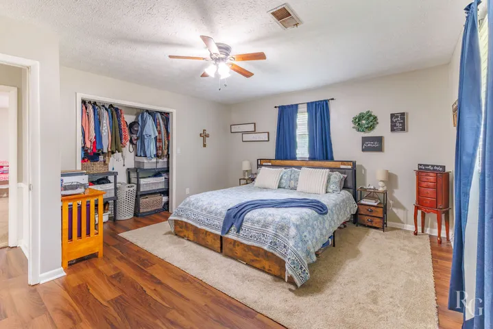 This spacious bedroom offers comfortable living with ample storage.