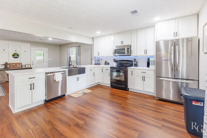 This spacious kitchen offers ample cabinet space and modern stainless steel appliances.