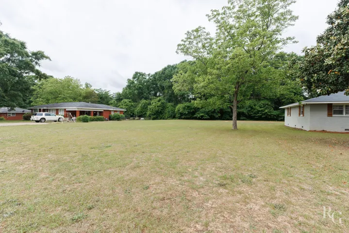 Expansive green grounds surround these charming residences, offering a serene outdoor environment.