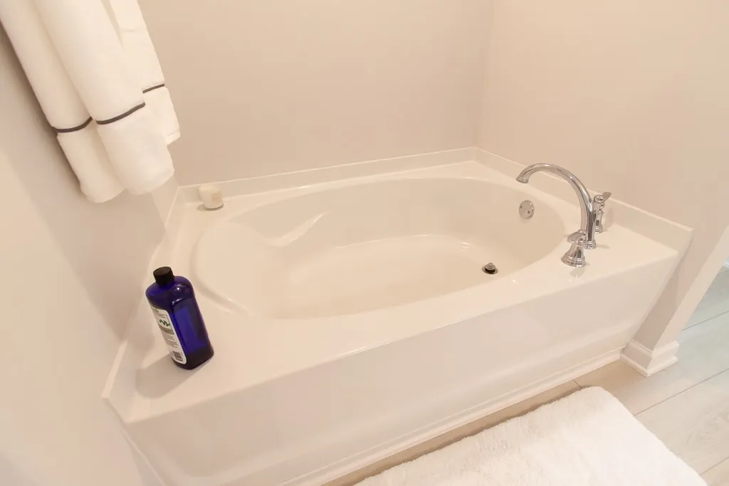 Relax and unwind in this inviting soaking tub, a perfect retreat after a long day.