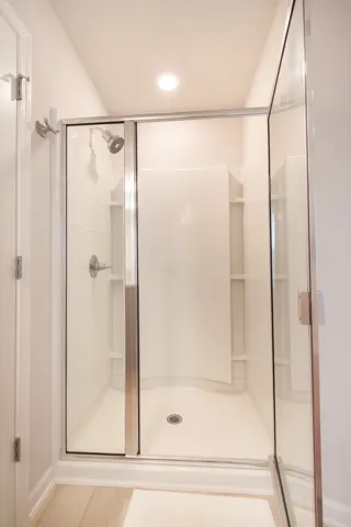 This sleek shower features a bright interior, offering a pristine and refreshing daily experience.