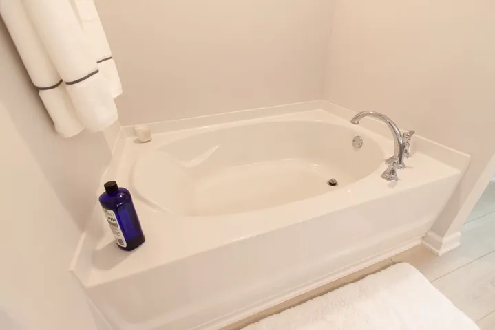 Relax and unwind in this inviting soaking tub, a perfect retreat after a long day.