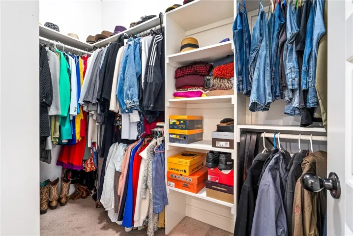 This spacious closet offers ample storage and organizational solutions for any wardrobe.