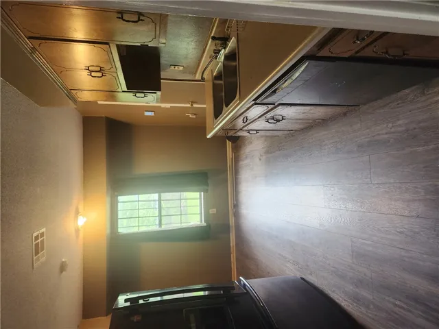 This functional kitchen features ample cabinetry and durable flooring for everyday living.