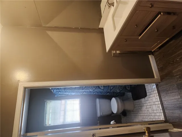 This bathroom features a contemporary vanity and stylish flooring.