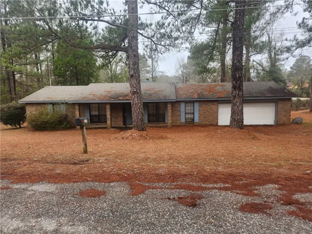 This cozy home offers a classic brick exterior and an attached garage.