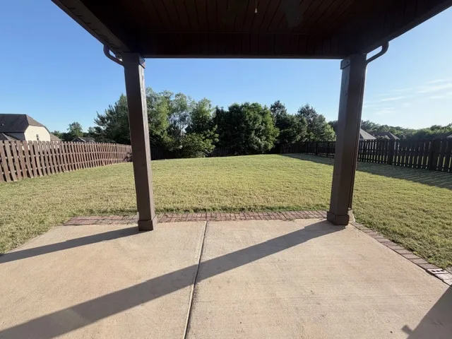 This spacious backyard with a private fence offers an ideal setting for relaxation and outdoor enjoyment.
