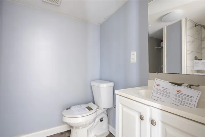 This newly updated bathroom features a sleek vanity and modern fixtures.