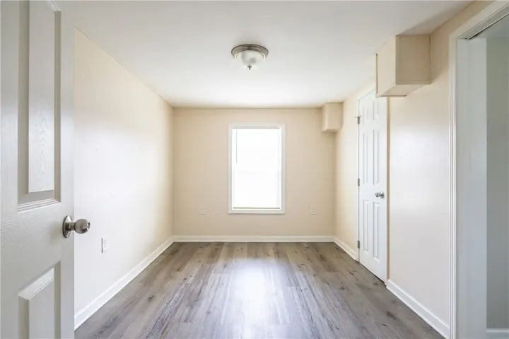 This versatile room features durable flooring and a bright window, offering a neutral canvas for your needs.