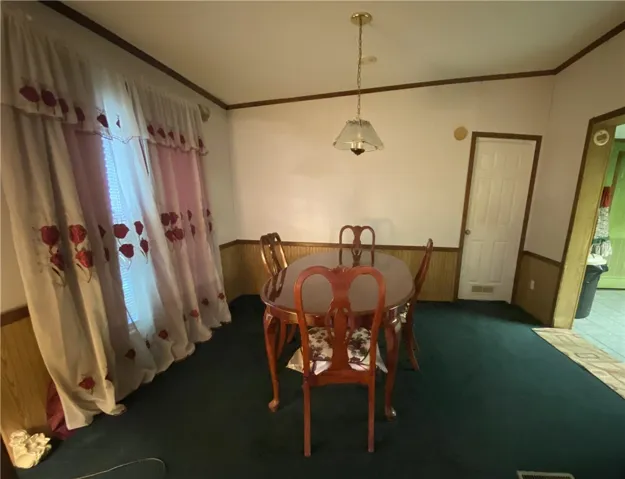 This cozy dining area is large enough to have a table, chairs and other miscellaneous pieces of furniture.