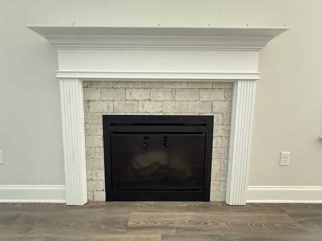This living room features a beautiful fireplace, perfect for cozy evenings.