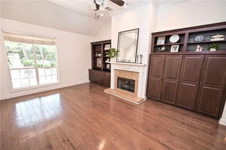 The high ceilings continue into the great room, where oversized windows add to the bright and airy ambiance.