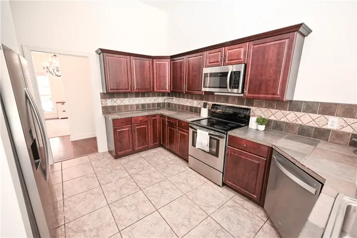 Kitchen with dining in background.