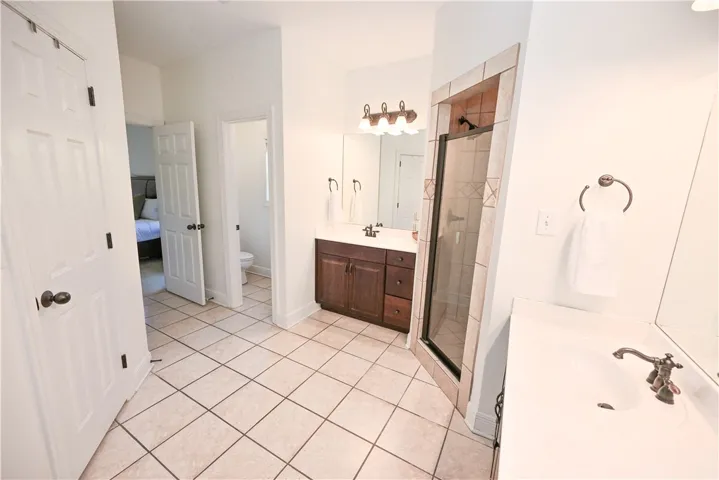 Dual vanities ensure plenty of storage and counter space.