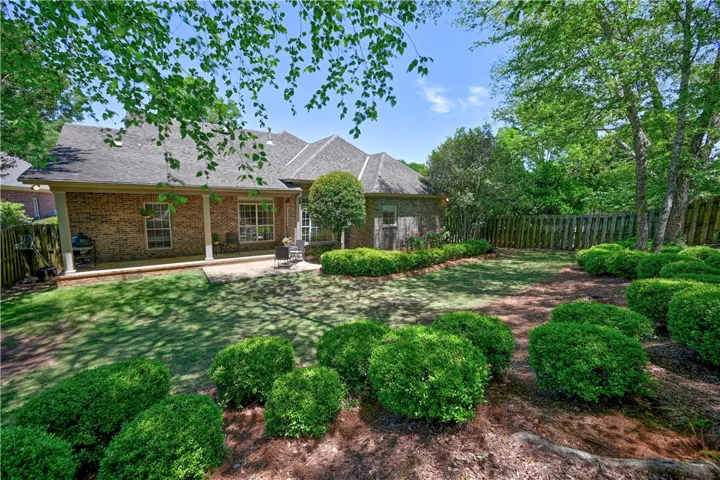 Mature trees and landscaping add both beauty and privacy.