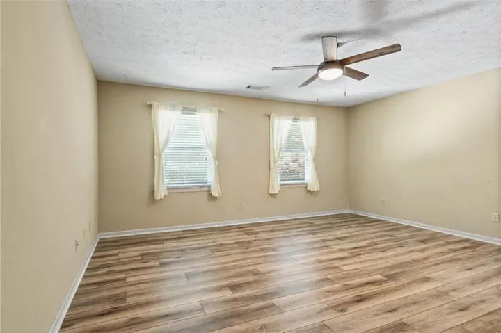 Bedroom 4, an additional primary suite, upstairs