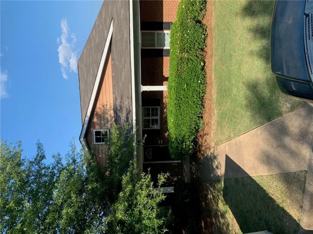 This classic brick residence offers inviting curb appeal and a well-maintained landscape.
