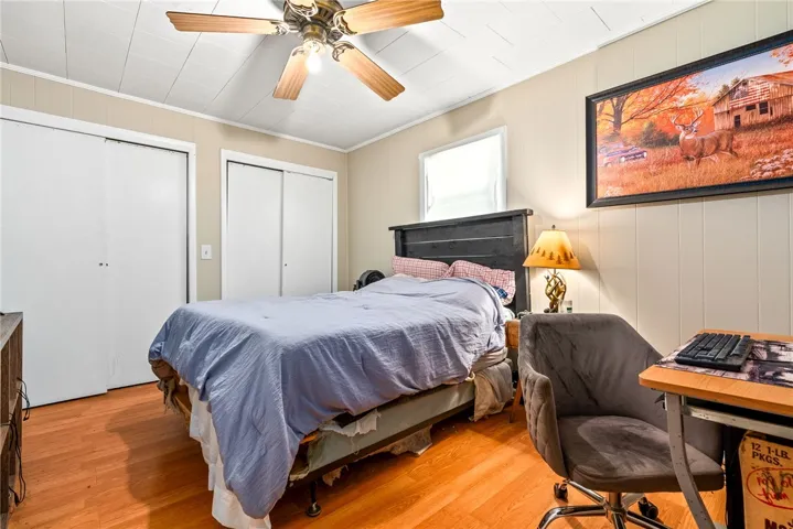 This cozy room features durable flooring and functional closet space, ideal for comfortable living.