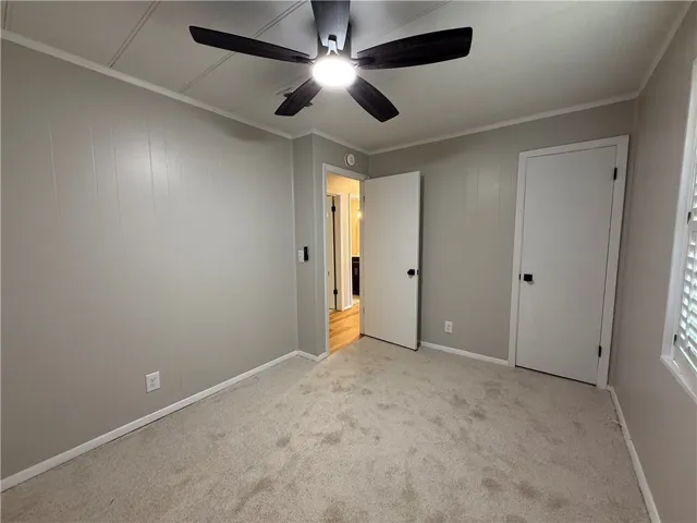 This inviting bedroom offers comfort and style, perfect for peaceful relaxation and personal touches.
