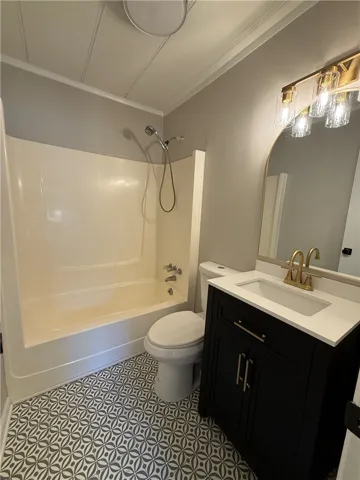 This bathroom features stylish flooring and a functional shower-tub combination for daily routines.