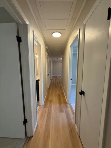 This spacious hallway offers seamless flow and a welcoming ambiance.