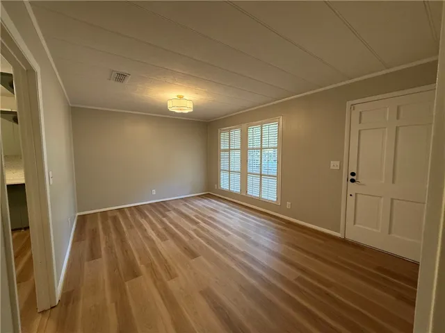 This versatile room offers bright window light and durable flooring, ready for your personal touch.