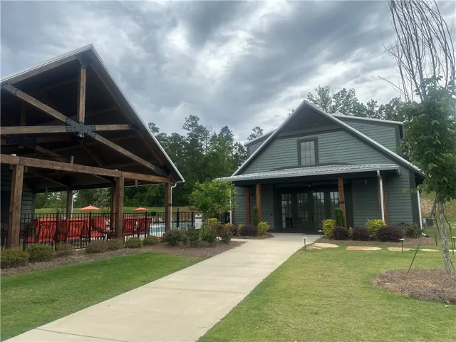 This charming community building offers versatile recreational spaces for residents.