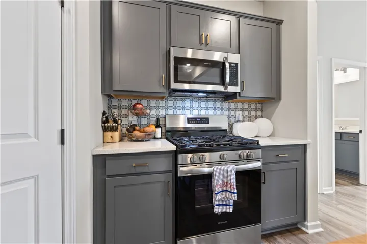 This thoughtfully designed kitchen boasts efficient cooking and stylish storage solutions.
