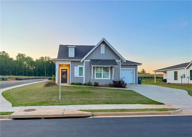 Minimalist Living!! Low maintenance home located in a high-amenity neighborhood. 
EV charger in garage convenient for your electric vehicle. 
Extended parking pad and rear patio.