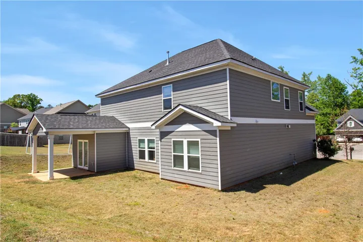 This residence showcases a well-maintained exterior, offering a blend of classic design and modern comfort.