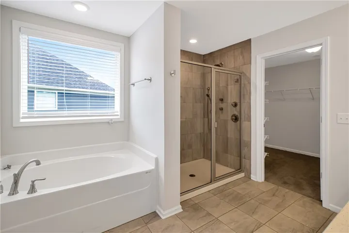 Relax in the deep soaking tub or rejuvenate in the tiled walk-in shower.