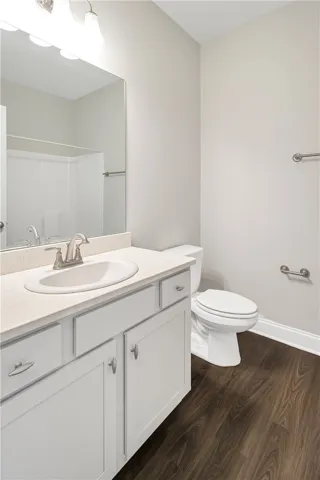 A well-appointed First Floor bathroom features a sleek vanity, mirror, and modern fixtures.