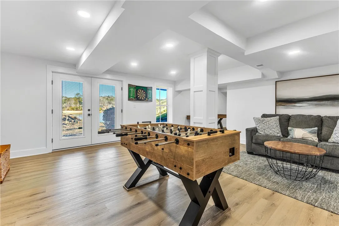 This versatile recreation room offers direct outdoor access and seamless indoor-outdoor living.